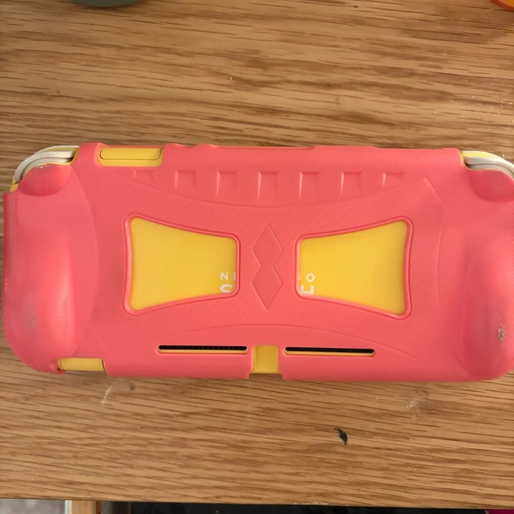 Yellow Nintendo Switch Lite (Comes with pink protective case)